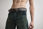 Close-up front view Tyler Andersen wearing brown AOA belt with rivets.