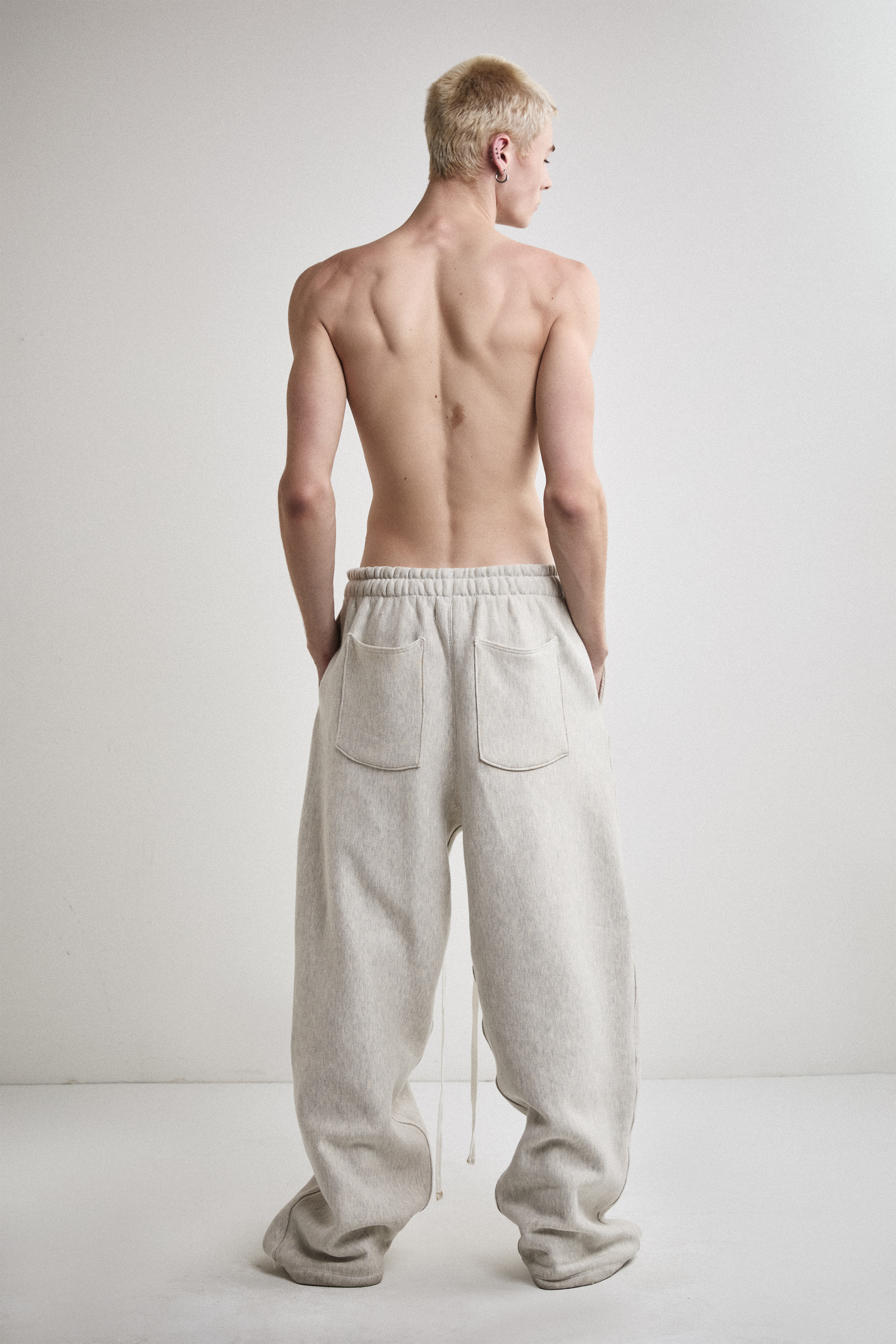 Back view of Tyler Andersen wearing AOA heavyweight grey sweats.