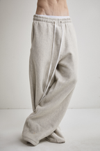 Close-up front view of Tyler Andersen wearing AOA heavyweight grey sweats.