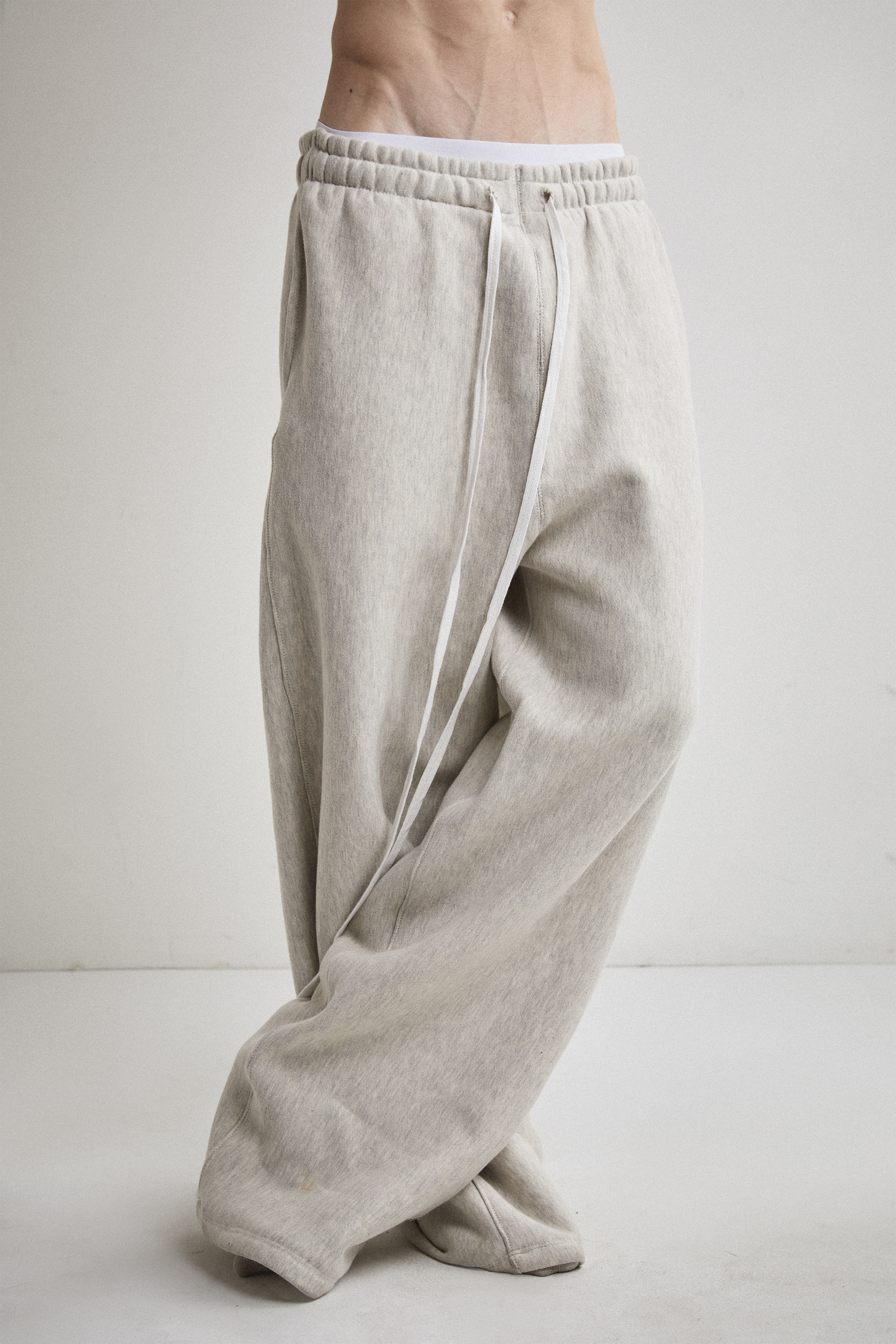 Close-up front view of Tyler Andersen wearing AOA heavyweight grey sweats.