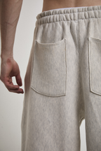 Ultra close-up back view of Tyler Andersen wearing AOA heavyweight grey sweats showing back pockets.