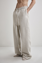 Close-up left side view of Tyler Andersen wearing AOA heavyweight grey sweats.