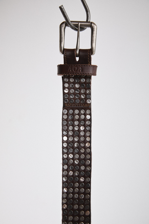 Close-up view of brown AOA belt with rivets.