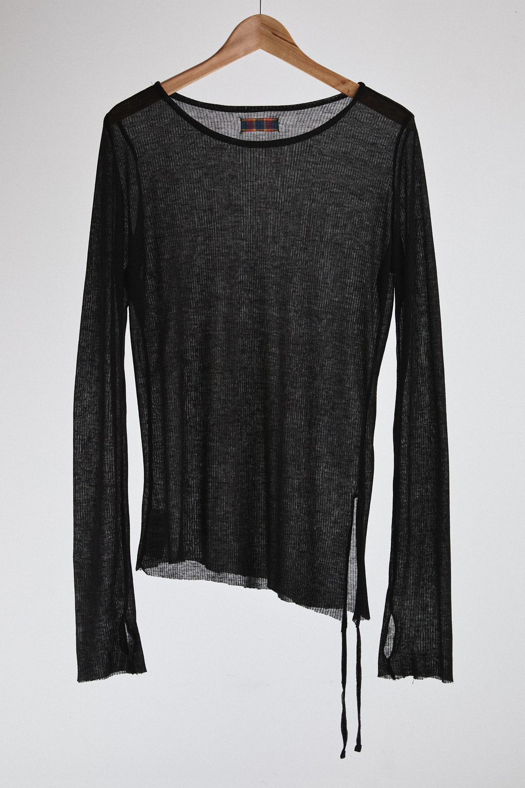 Front view of sheer long-sleeve AOA Black top.