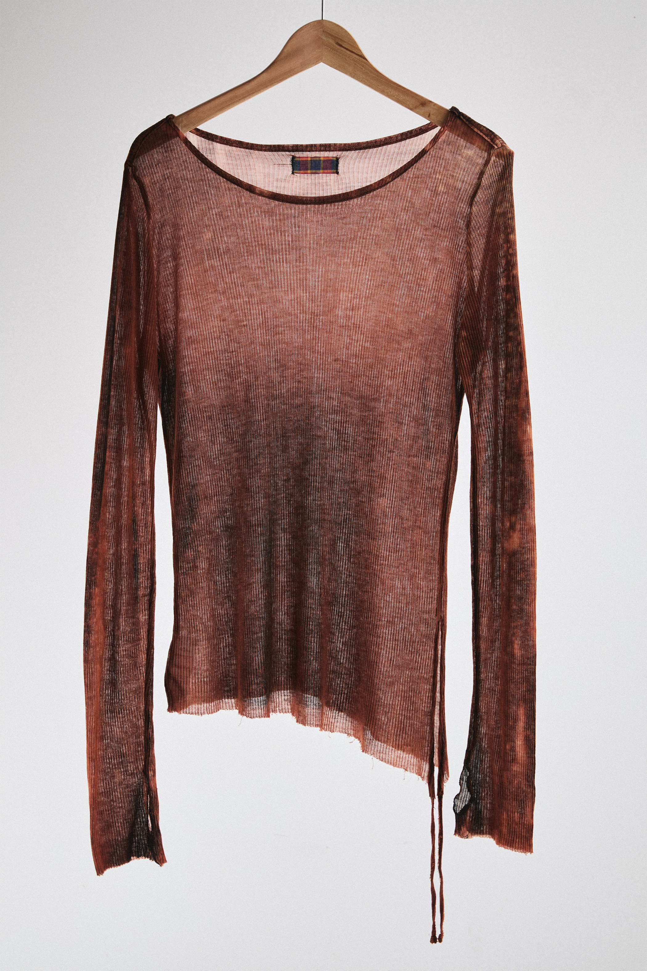 Front view of sheer long-sleeve AOA rust top.